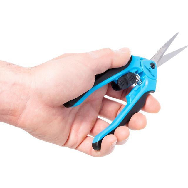 hand holding the blue blade scissors